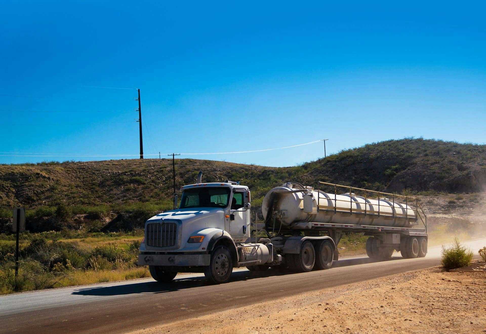 oil truck driving on road