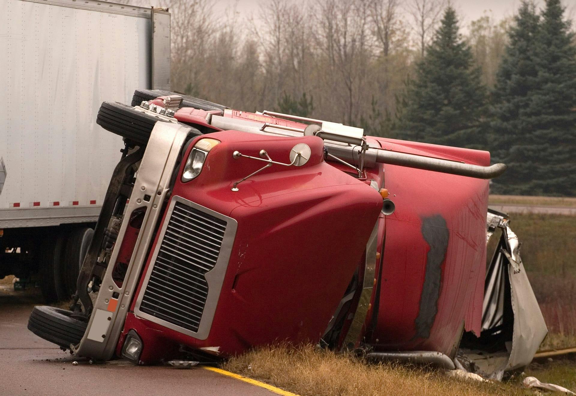 semi truck on its side