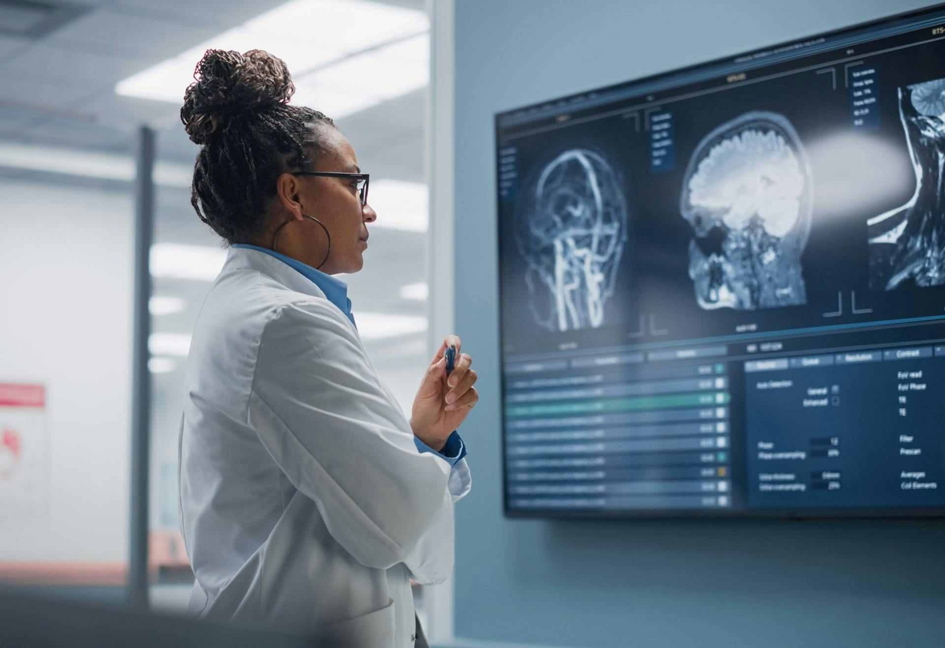 doctor examining an x-ray image of a head