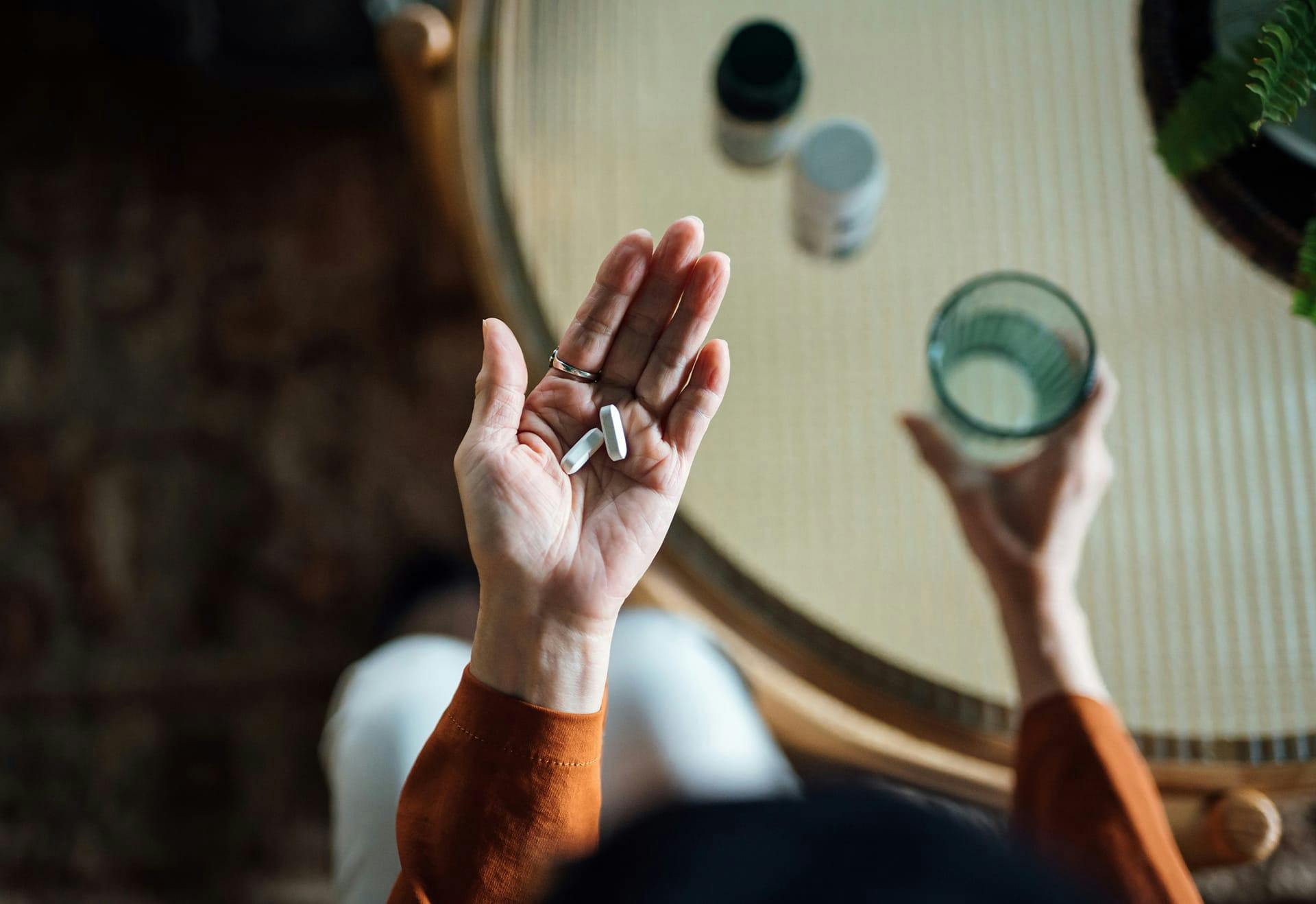 pills in a persons hand