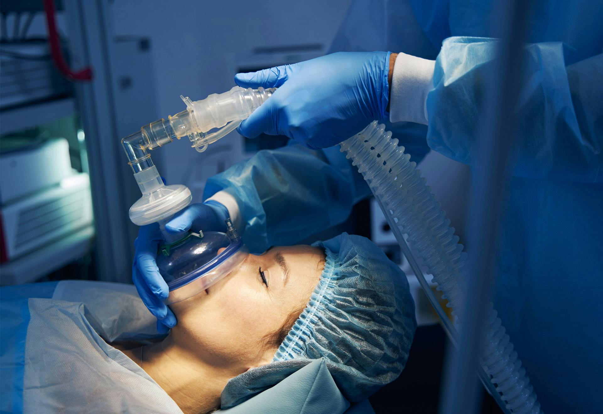 Woman with anesthetic being administered.