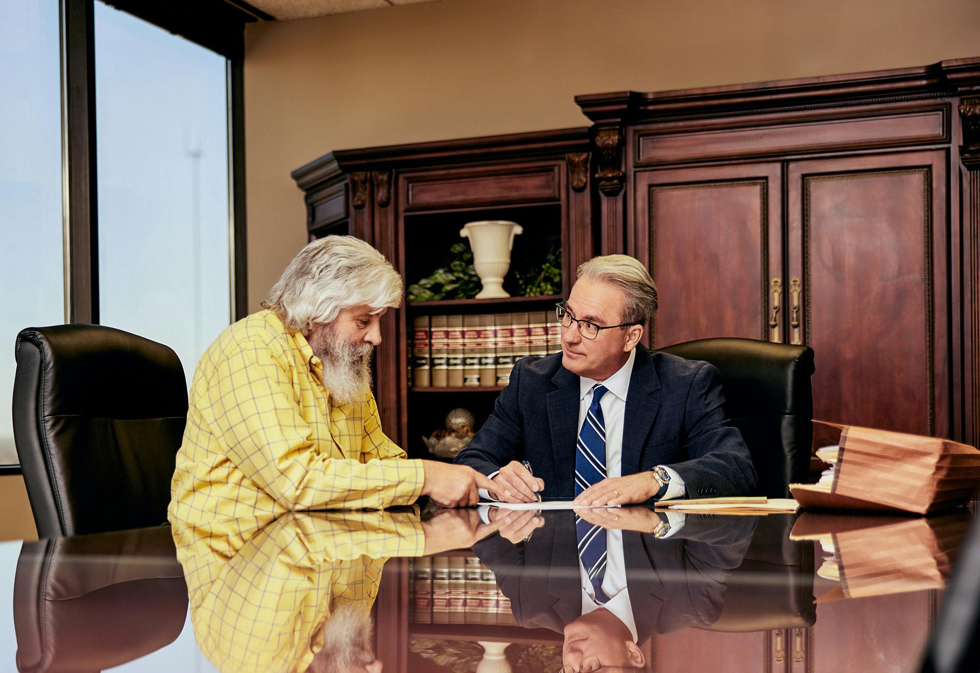 Lawyer James Belote meeting with a client