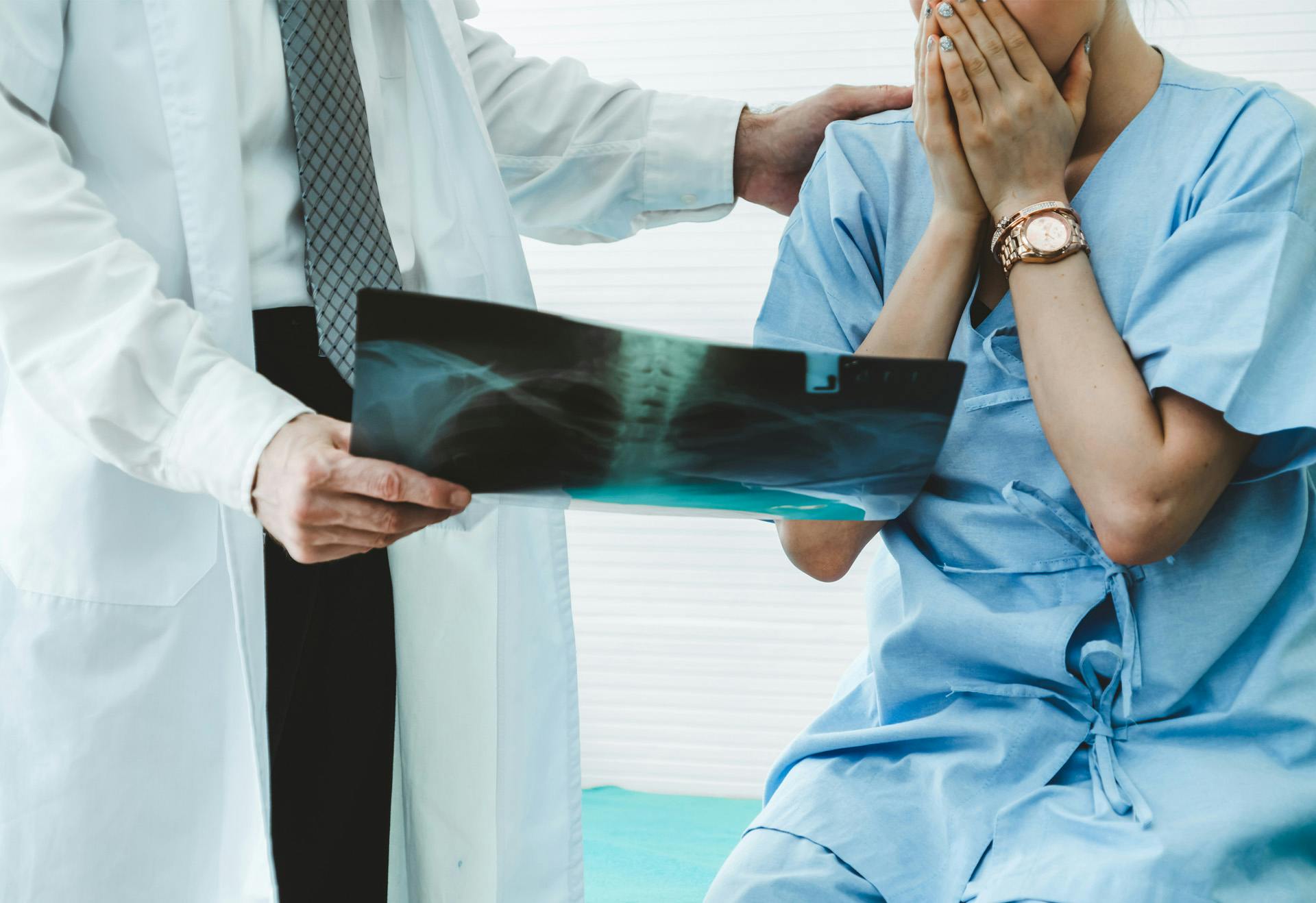 Person looking at an xray with doctor
