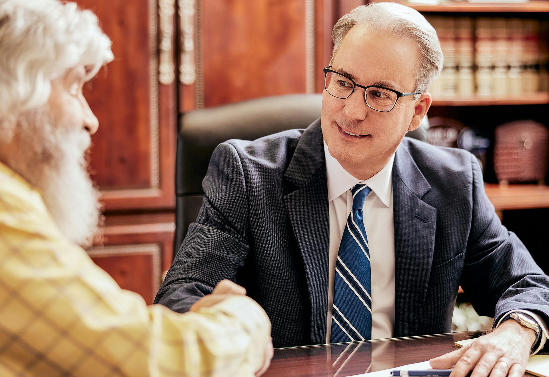 Attorney Belote consulting with a client.