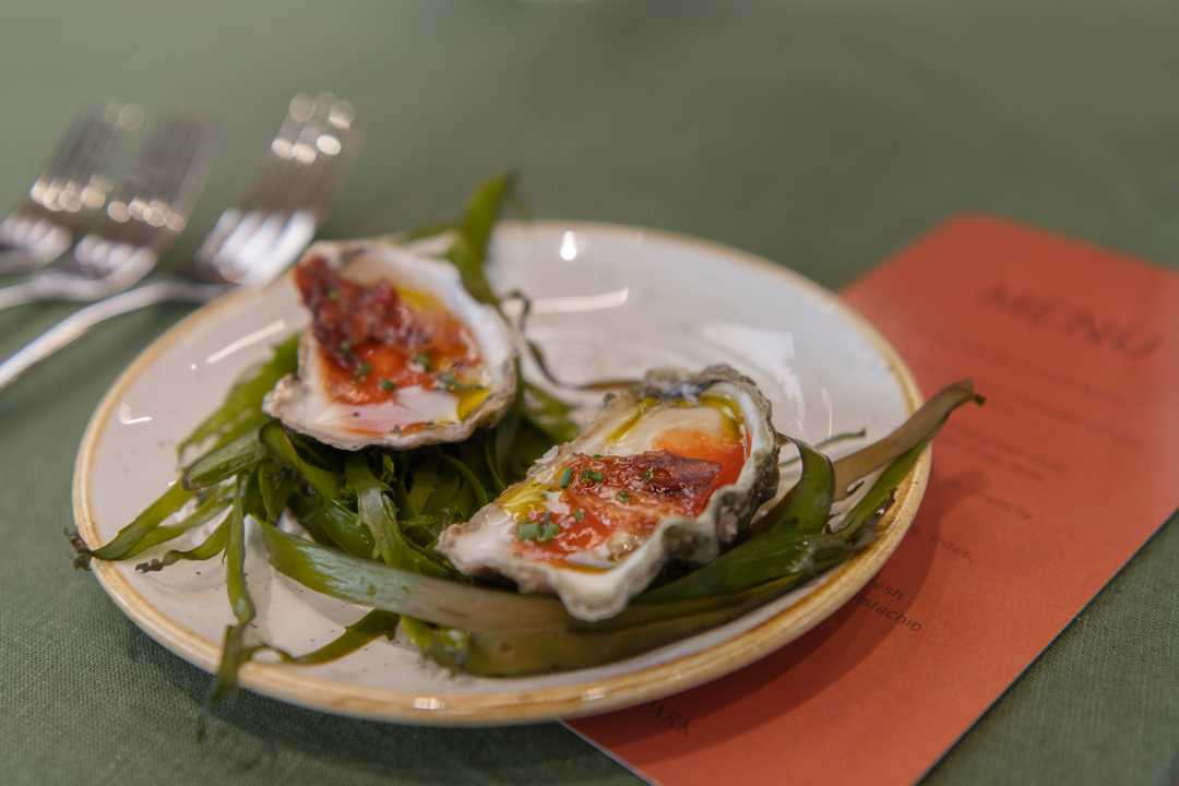 Clyde River Oysters, accompanied by fermented tomato and chicken skin