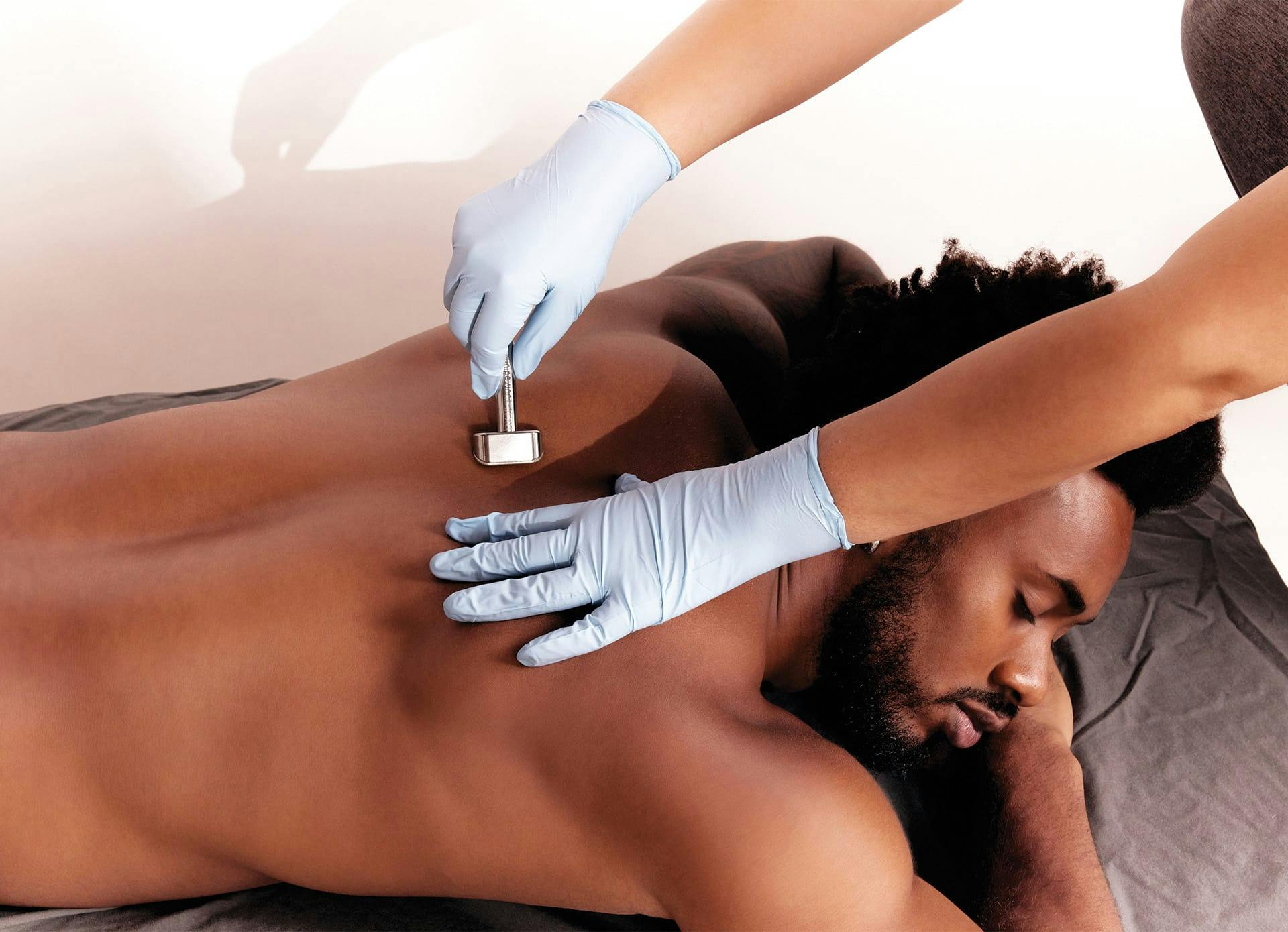 Male Getting DiamondTouch Treatment on his Back