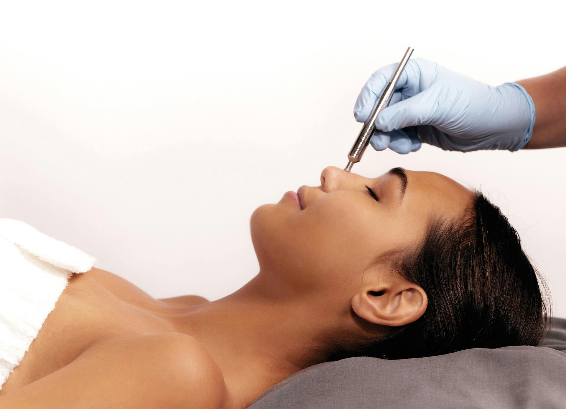 Woman Getting DiamondTome on Face