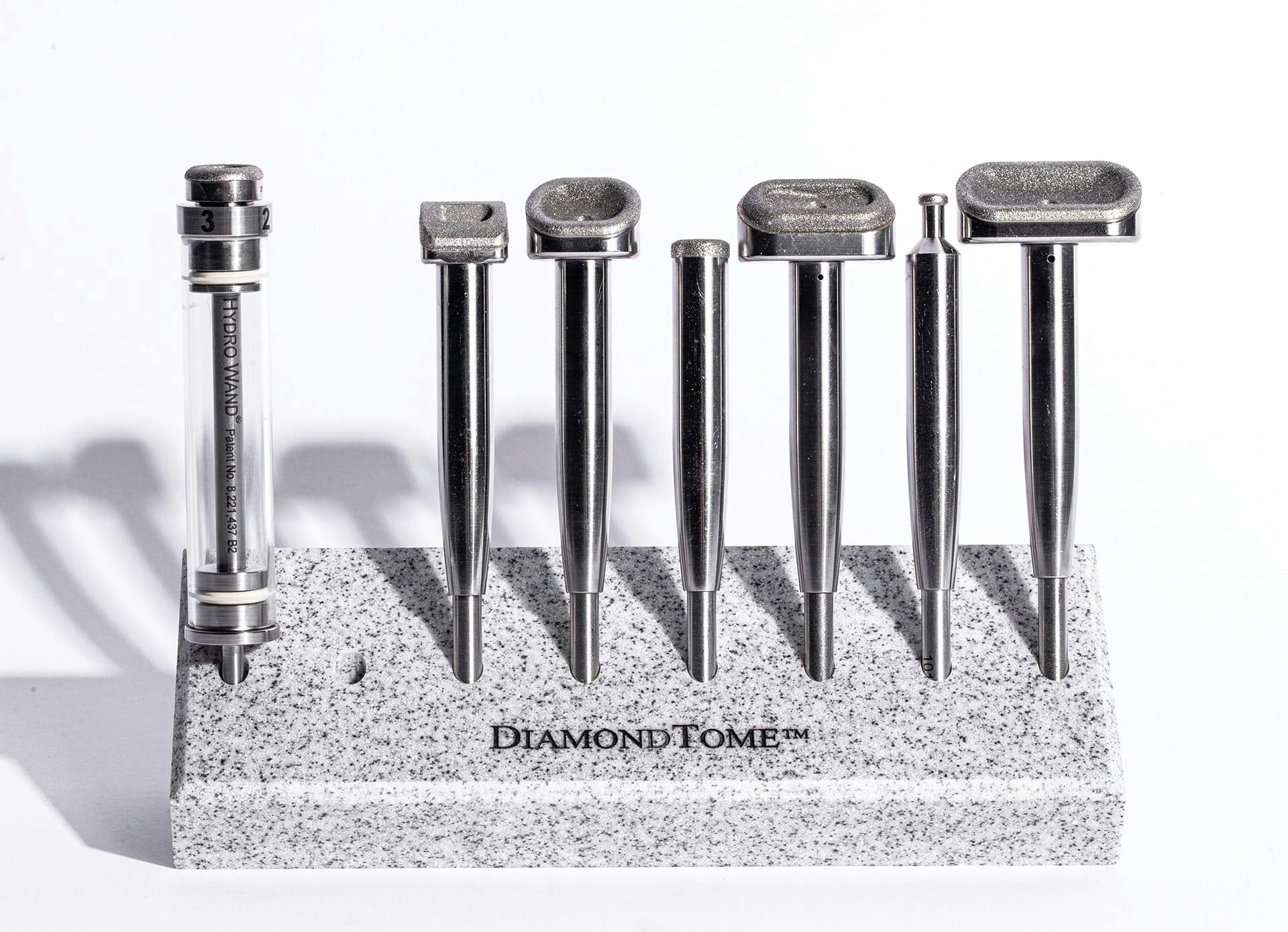 there are five different DiamondTouch system parts on a stand with a white background