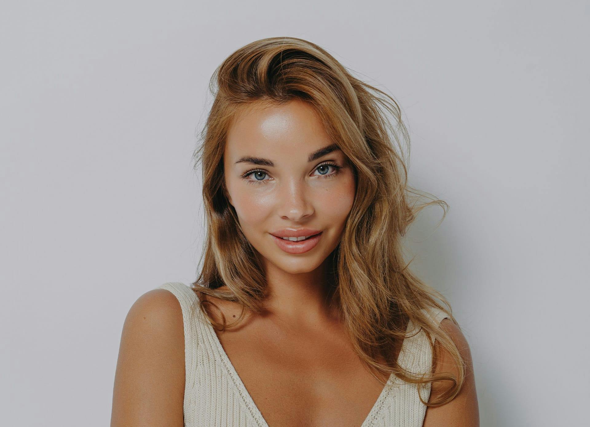 Beautiful Blond Woman with Smooth Skin on Her Neck