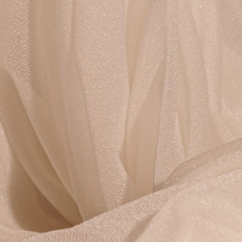 there is a close up of a white sheer fabric with a black background