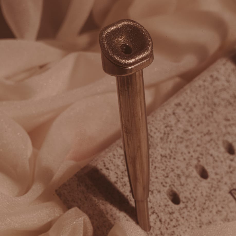 there is a Diamond Device part that is sitting on a table stand