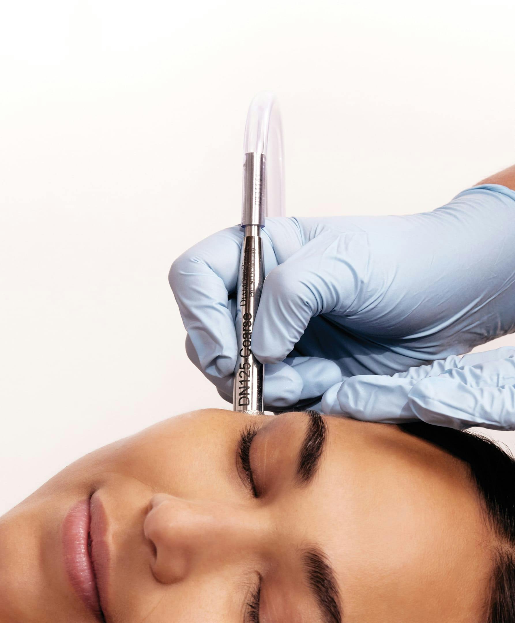 woman getting a micro needle injection from a doctor