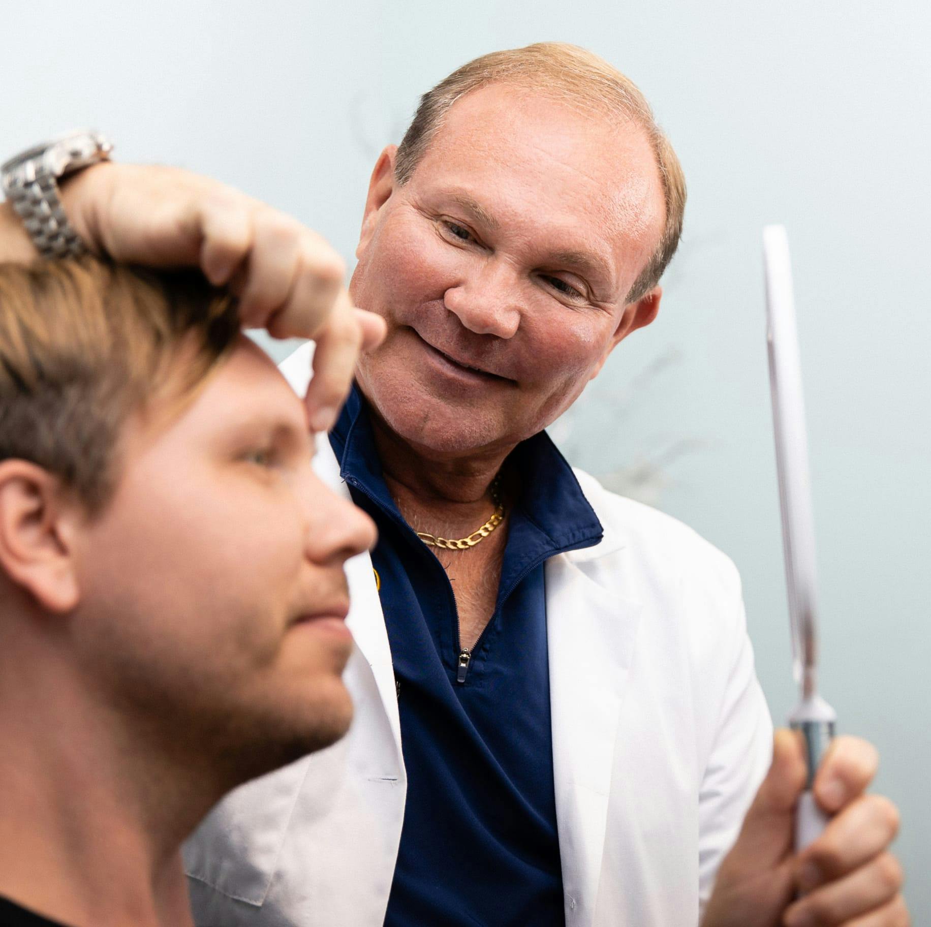 Dr. Young examinig a patient.