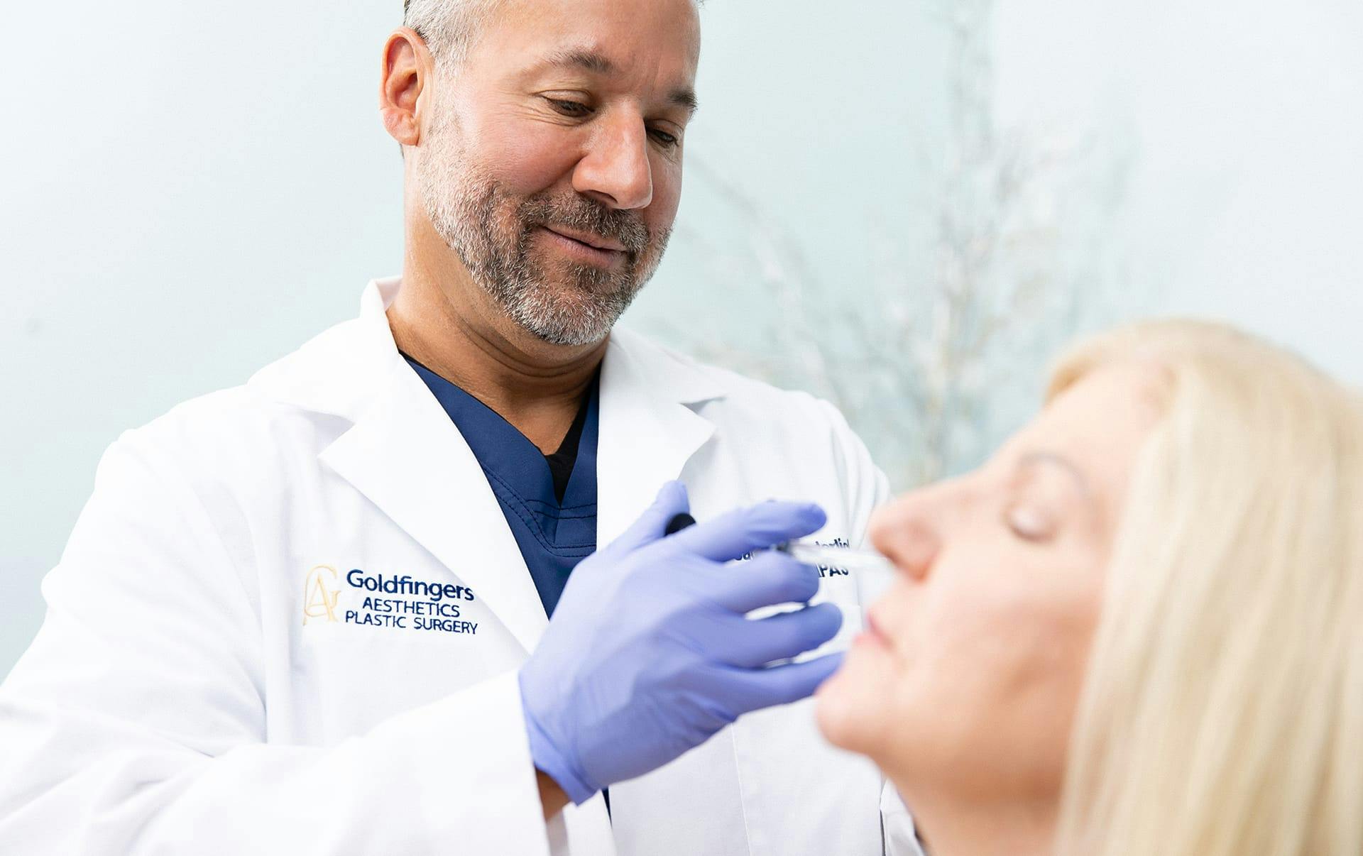 Doctor giving patient fillers