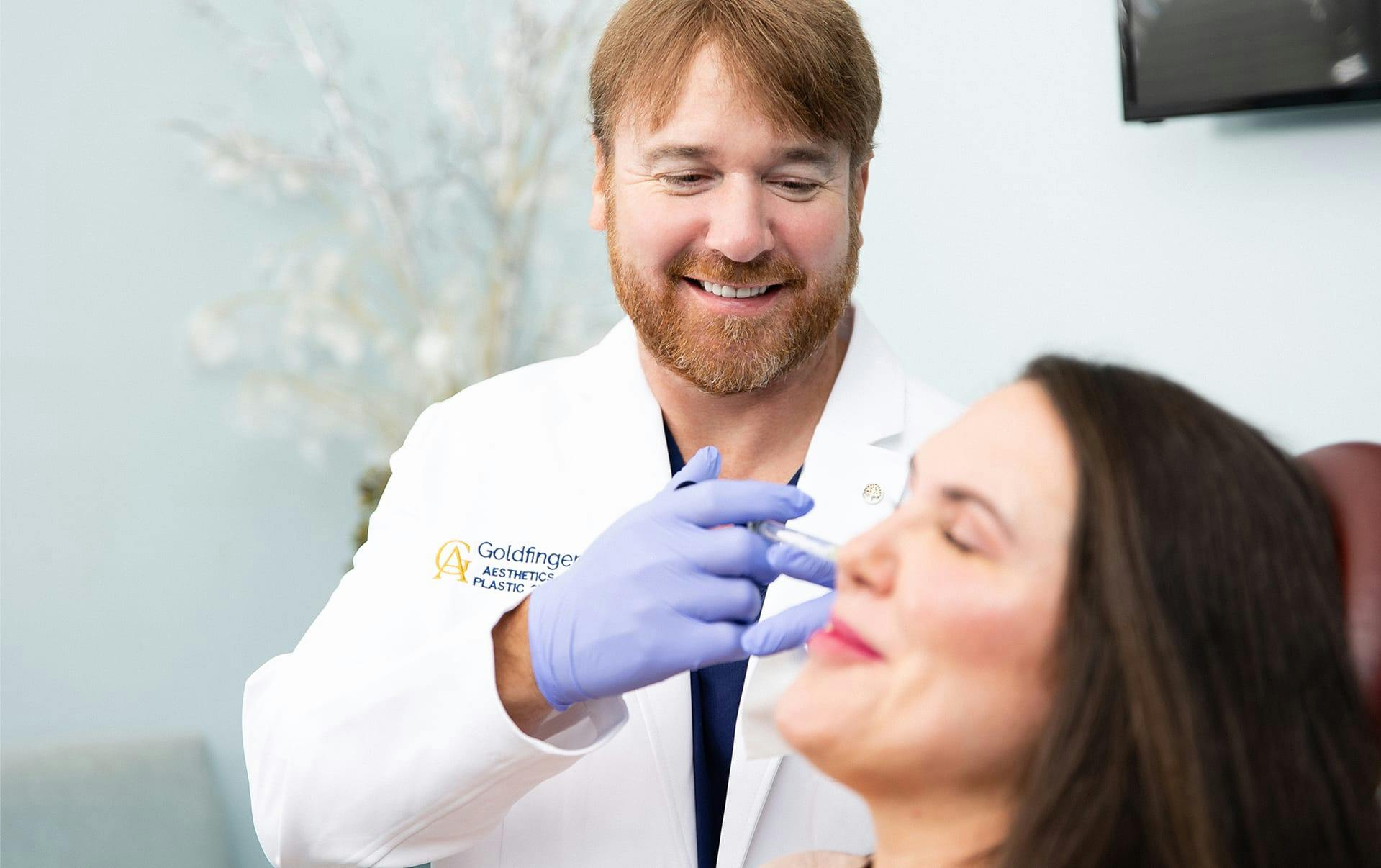 Doctor applying dermal fillers to patient