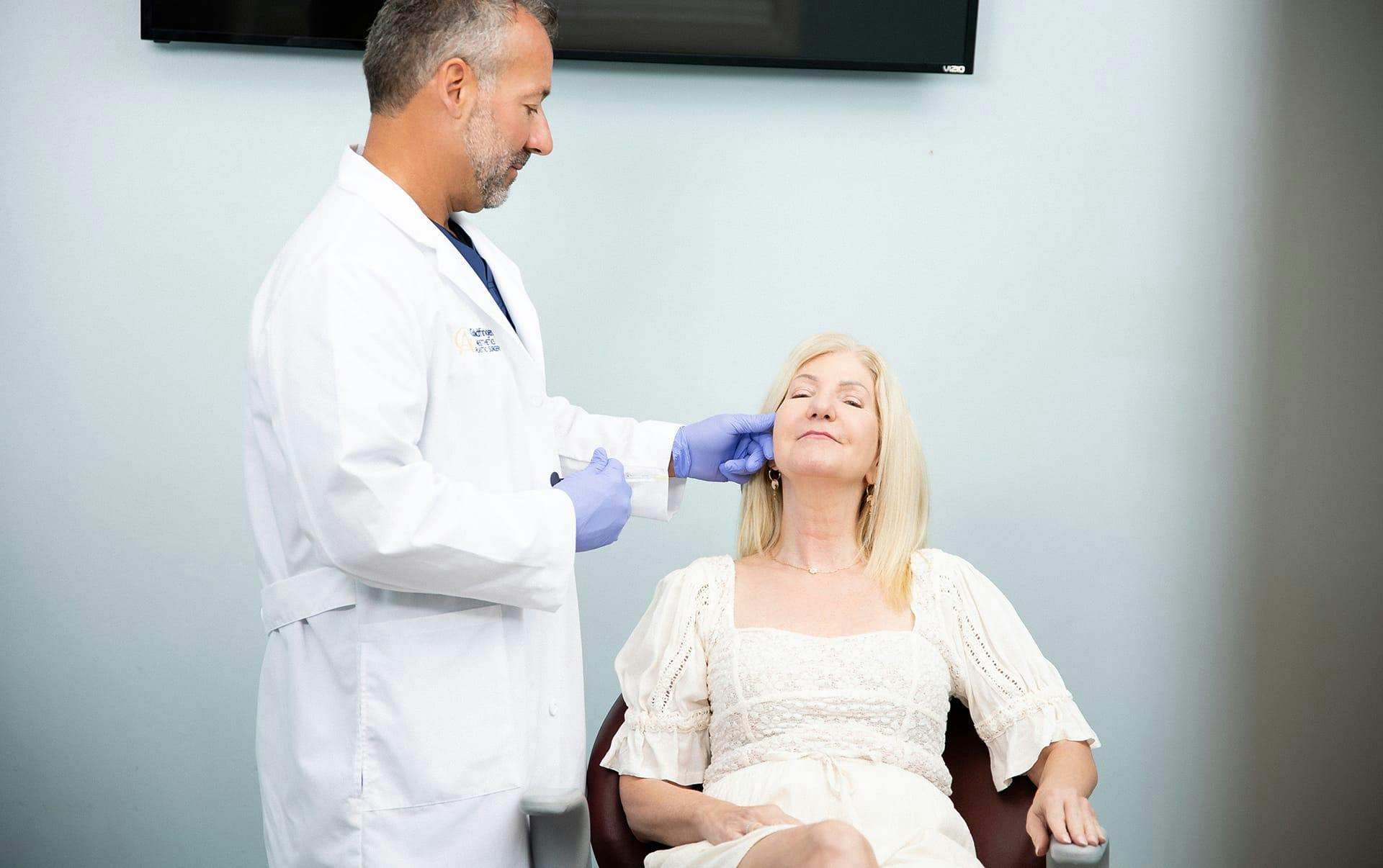 doctor working with patient in chair