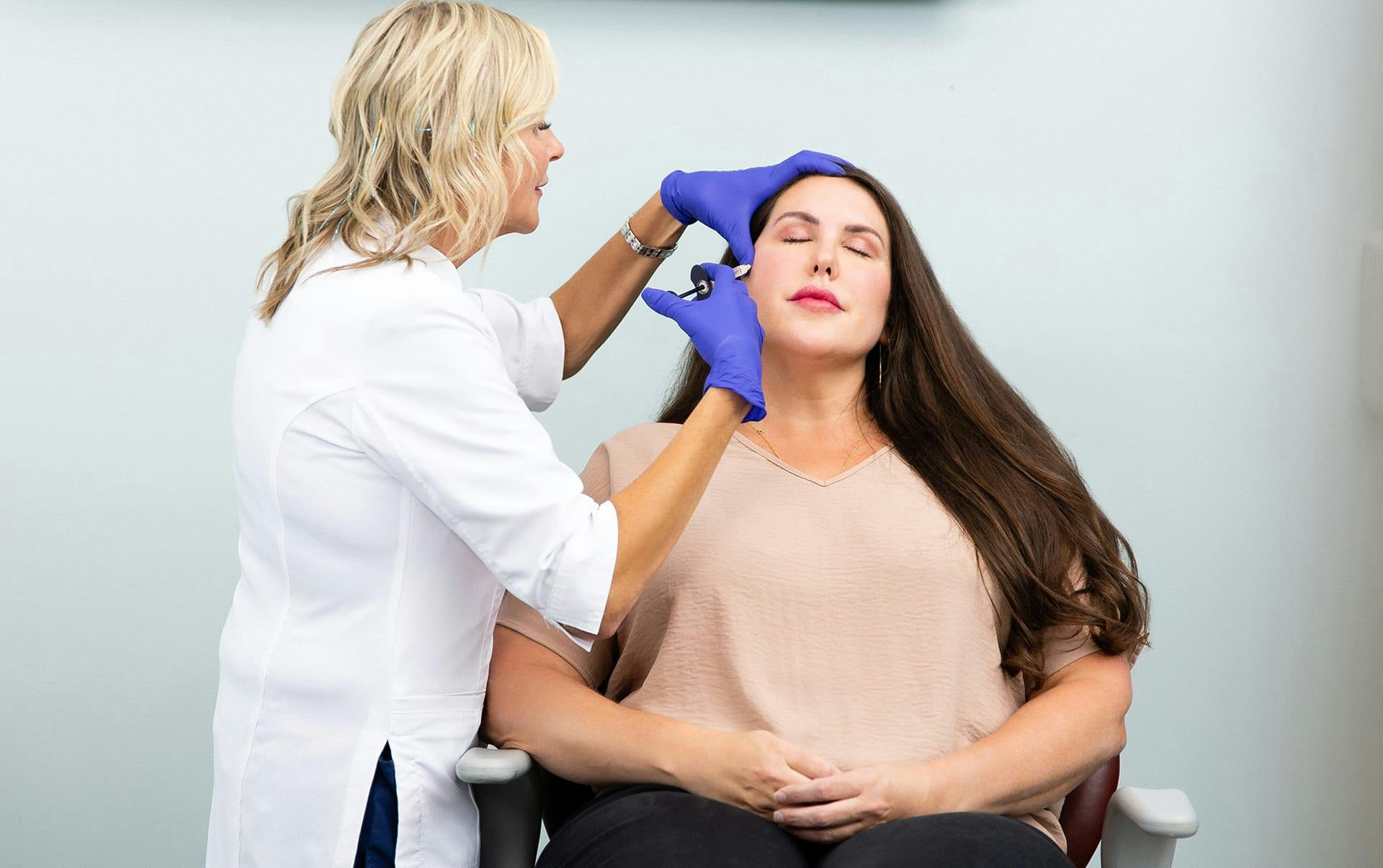 Woman receiving facial injection