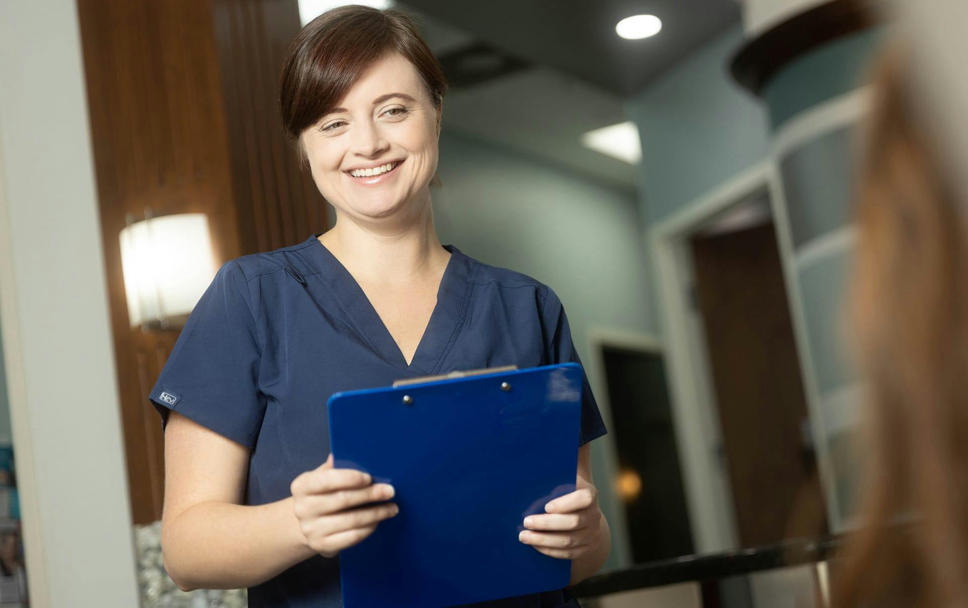 nurse holding clipboard