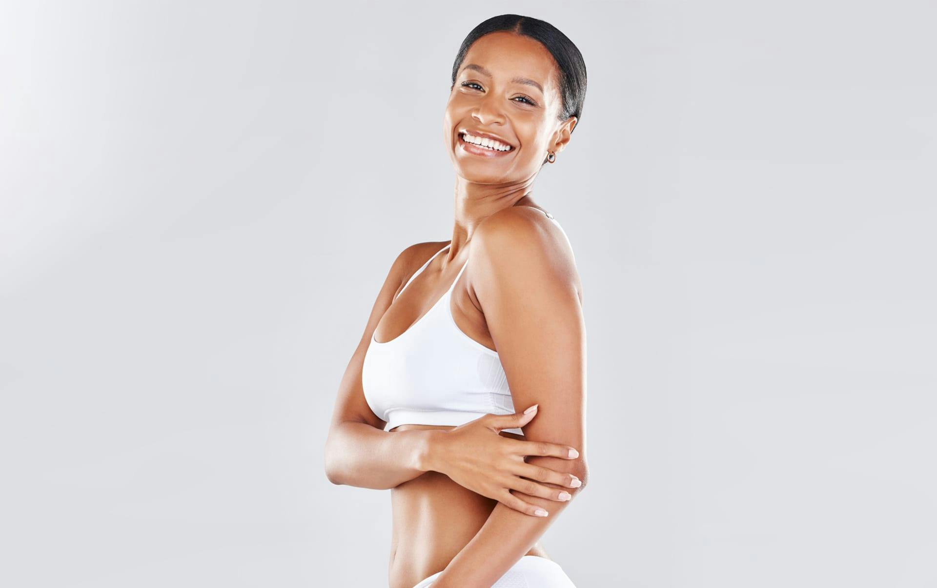 woman in white bikini smiling