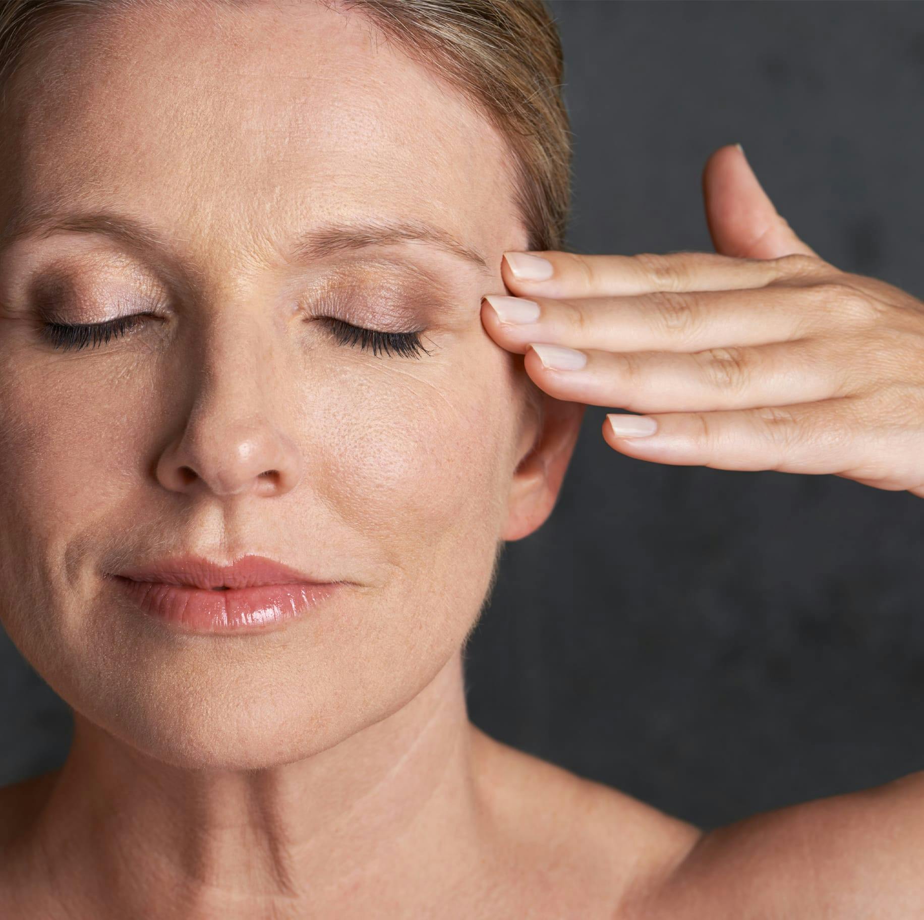 Woman indicating eyelid