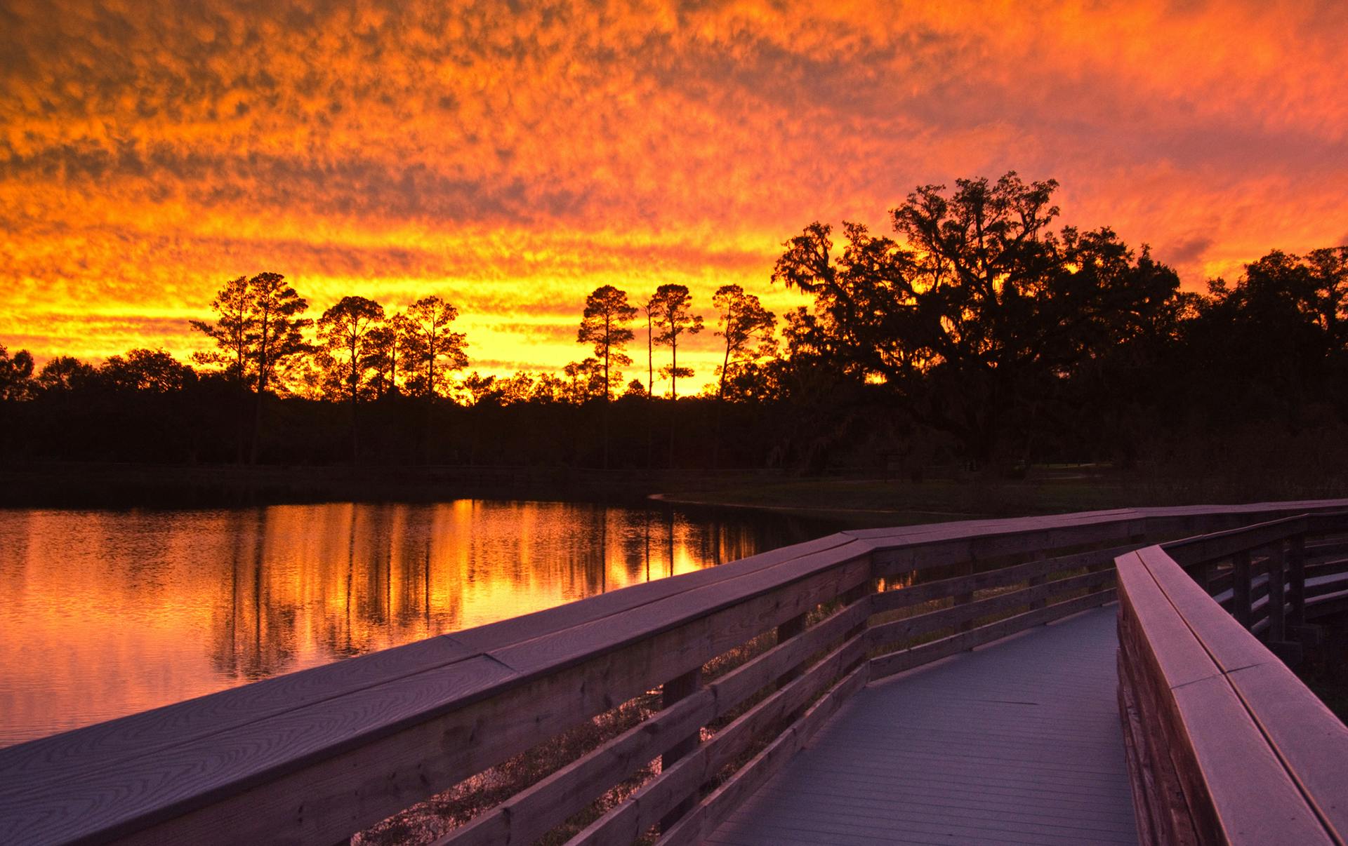 sunset over lake from boardwalk