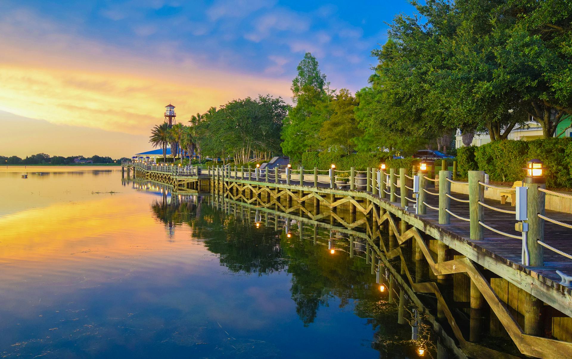 boardwalk along lake at sunset