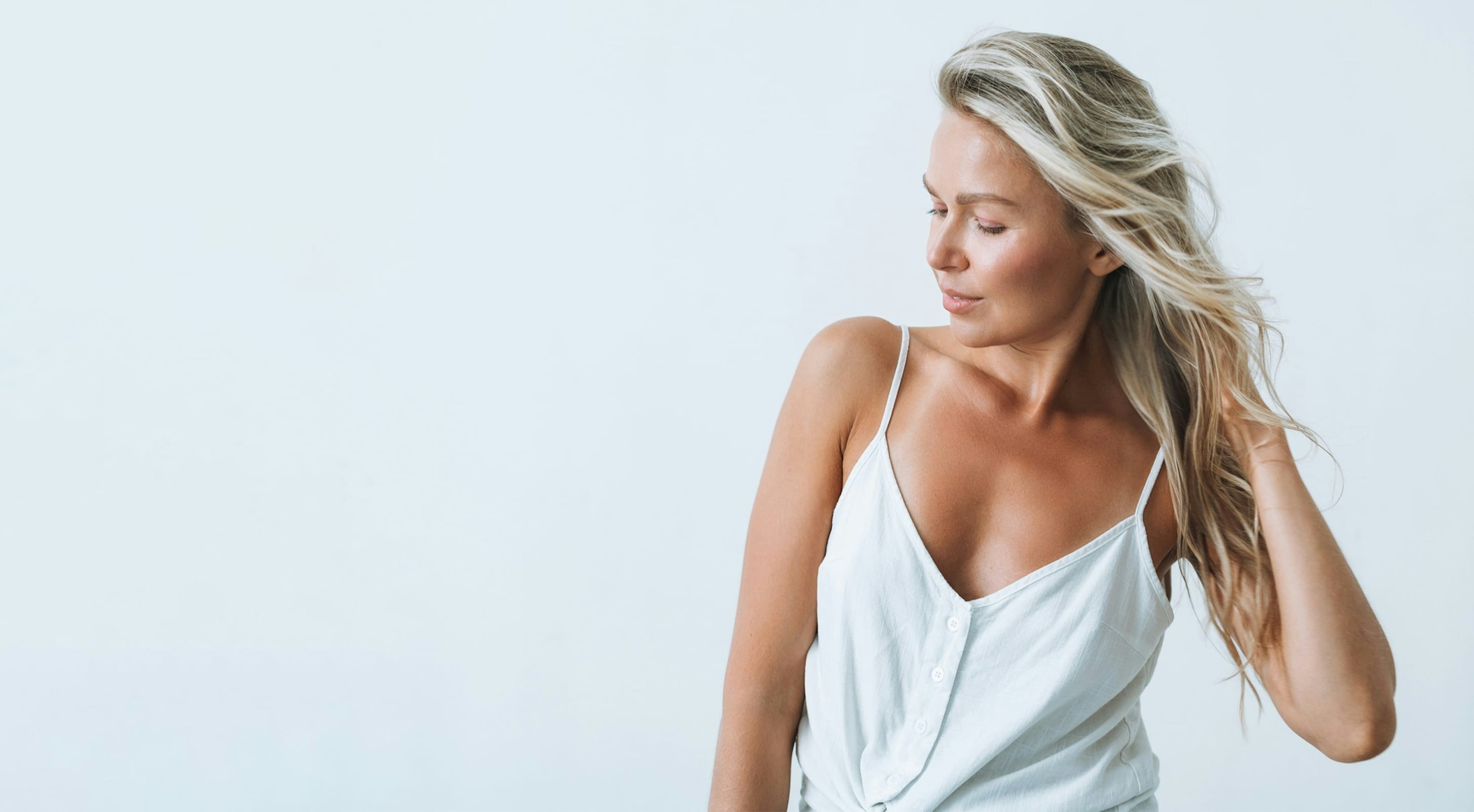 Woman with blond hair, looking down