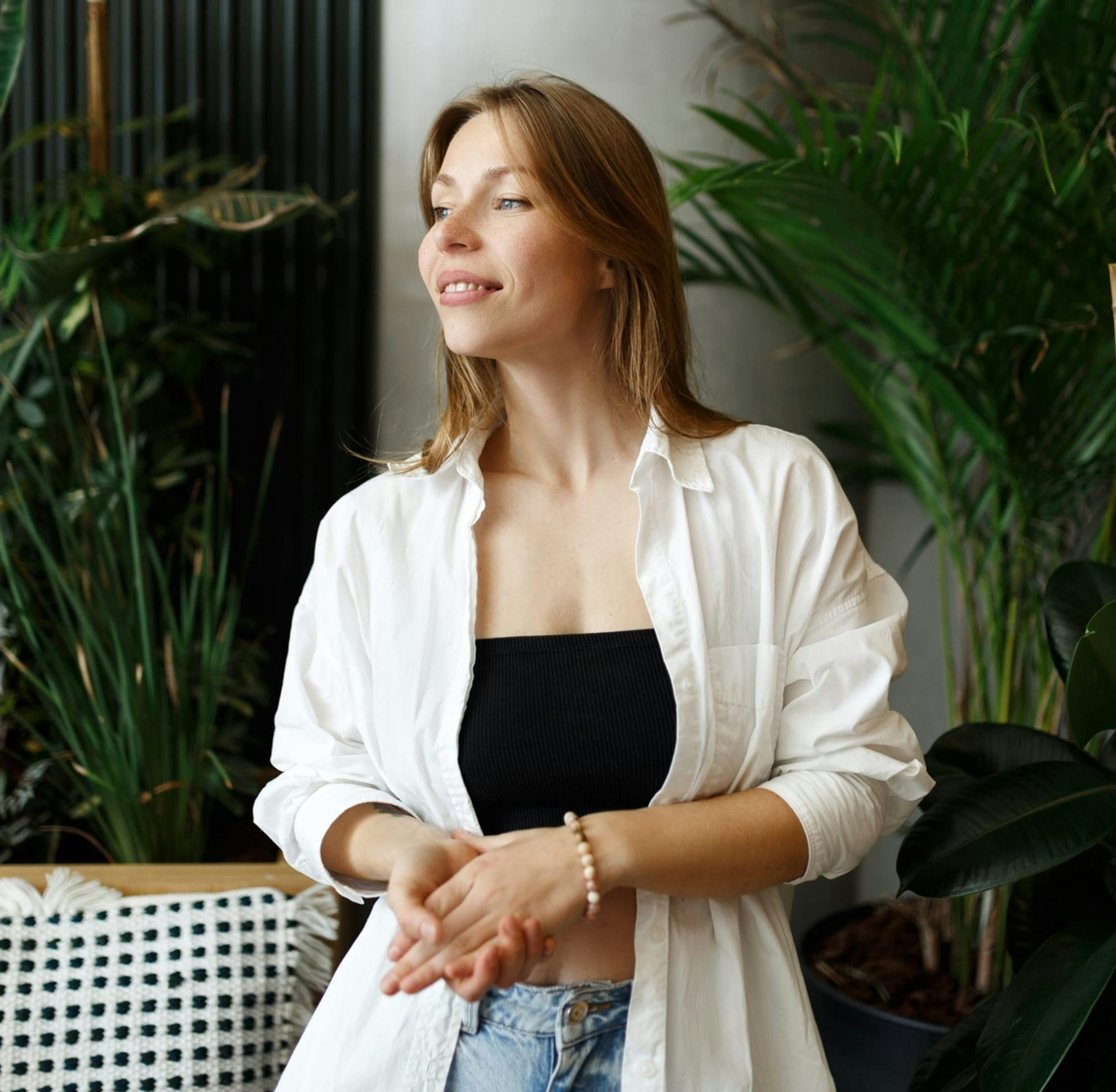 Woman holding her hands, smiling