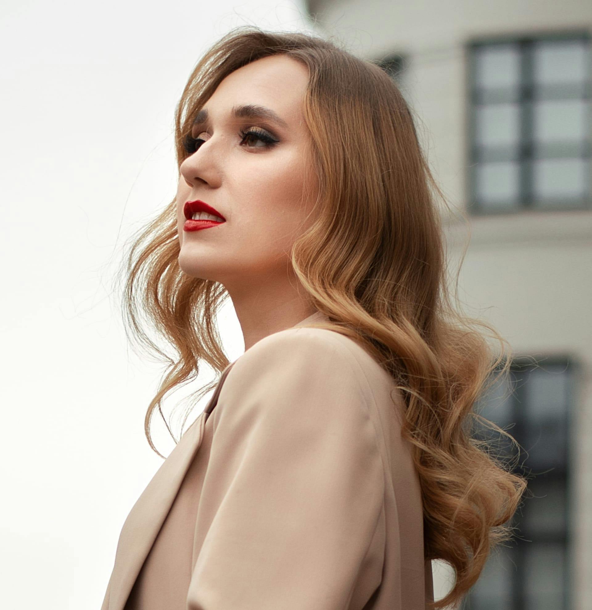 Woman in a suit looking to the side