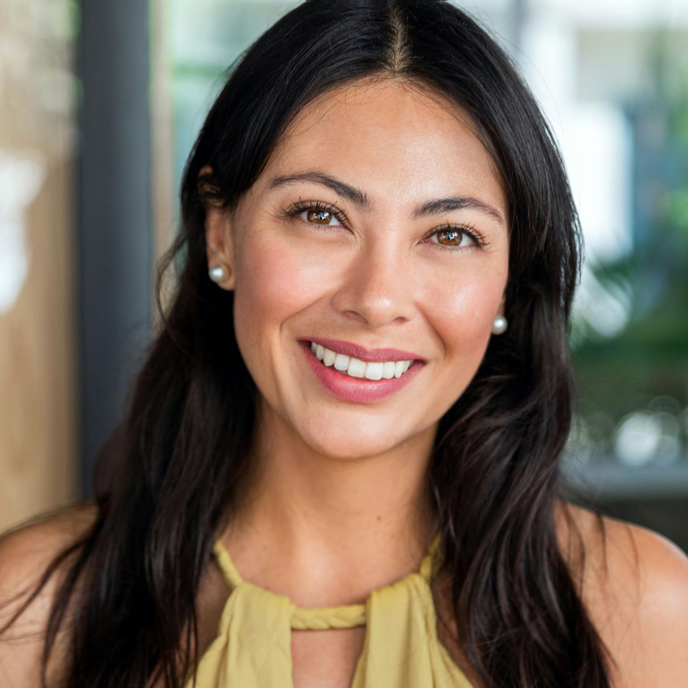 Woman with black hair, smiling