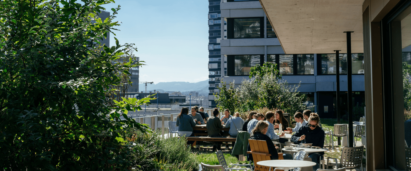 People sitting outside on a roof terrace garden