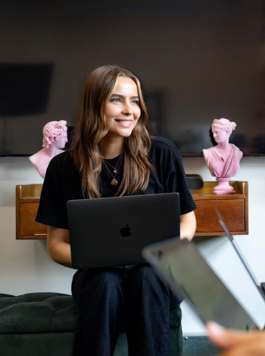 Woman sitting and smiling