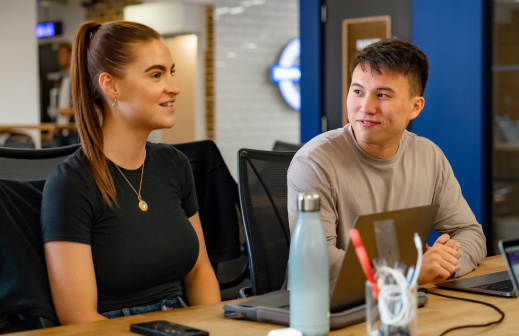 Two people working at a desk