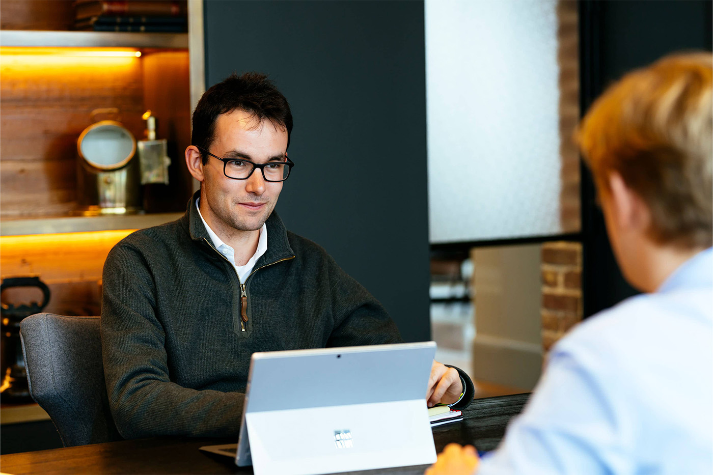 Two men working together with iPads