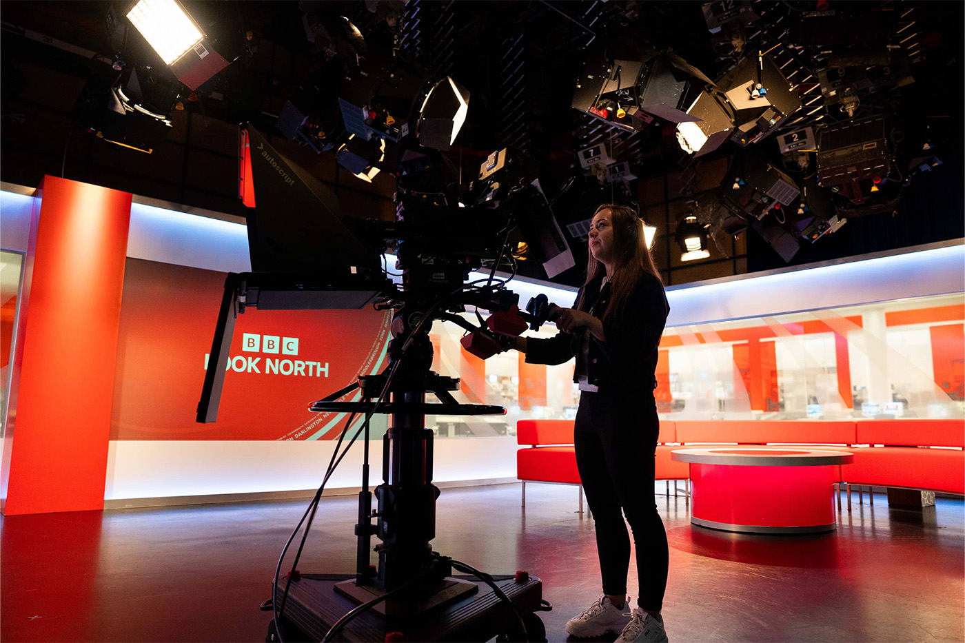 Woman operating a camera in BBC Look North studio