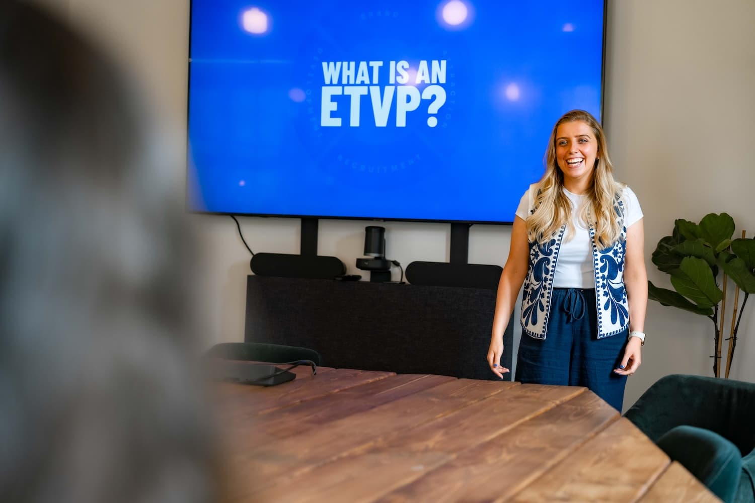 Young blonde woman at work presenting a session called 'What is an ETVP?'