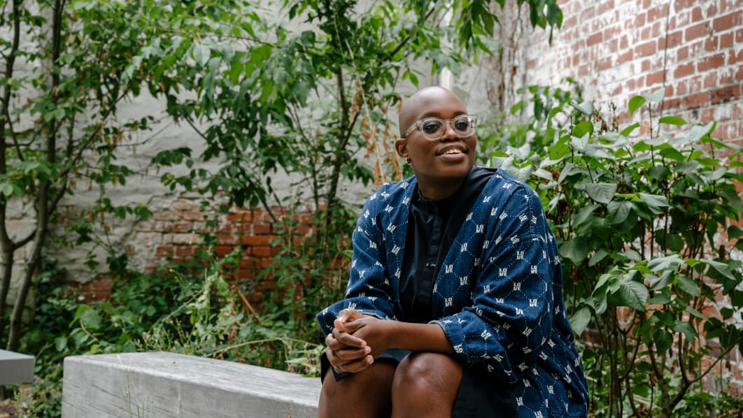 Woman sat down smiling