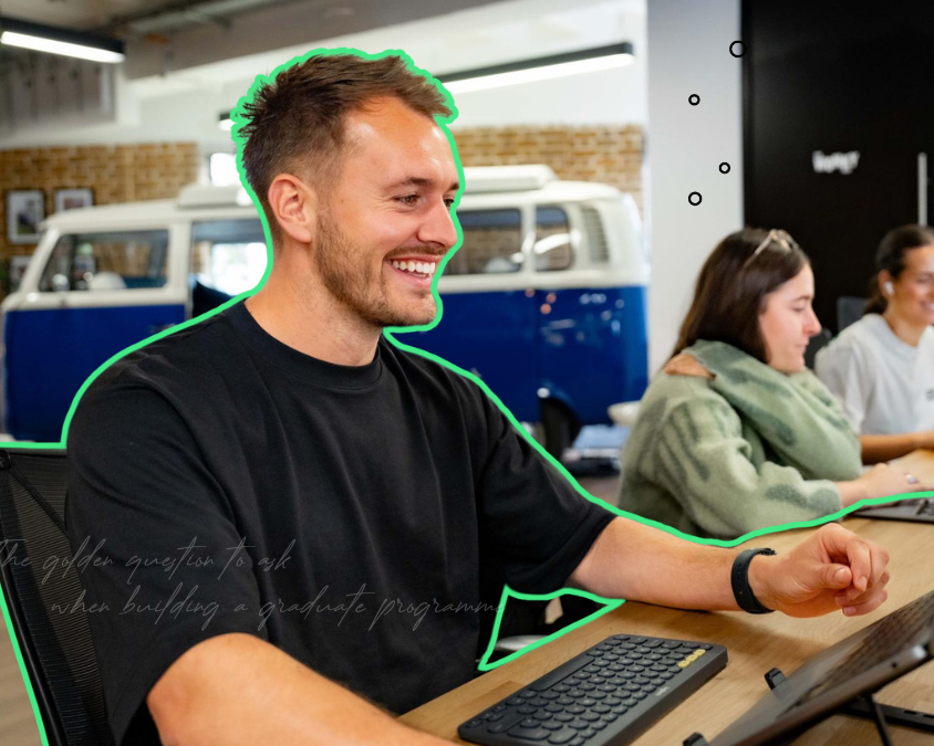 Man smiling at laptop screen