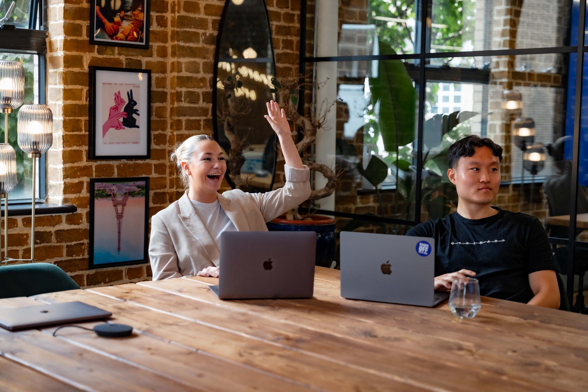 Man and woman at work engaging in a meeting