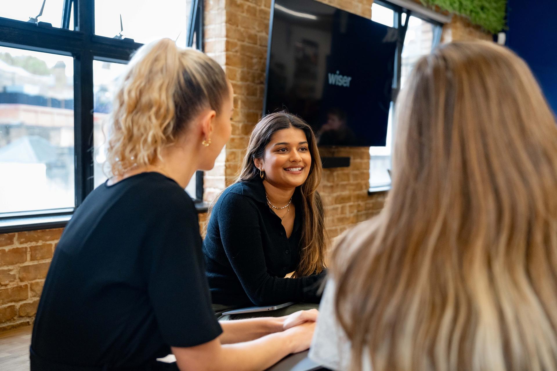 Three women during a work meeting