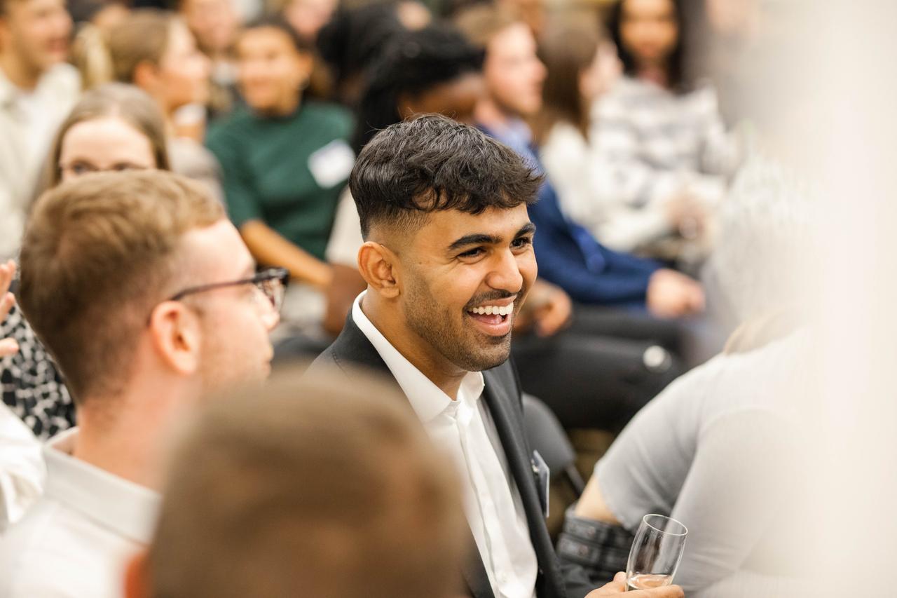 Young man at a student panel event