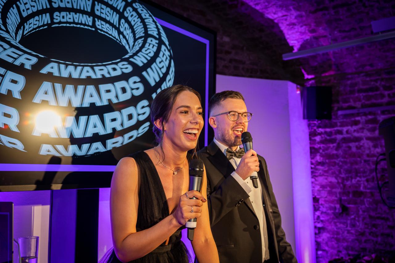 Man and woman presenting award