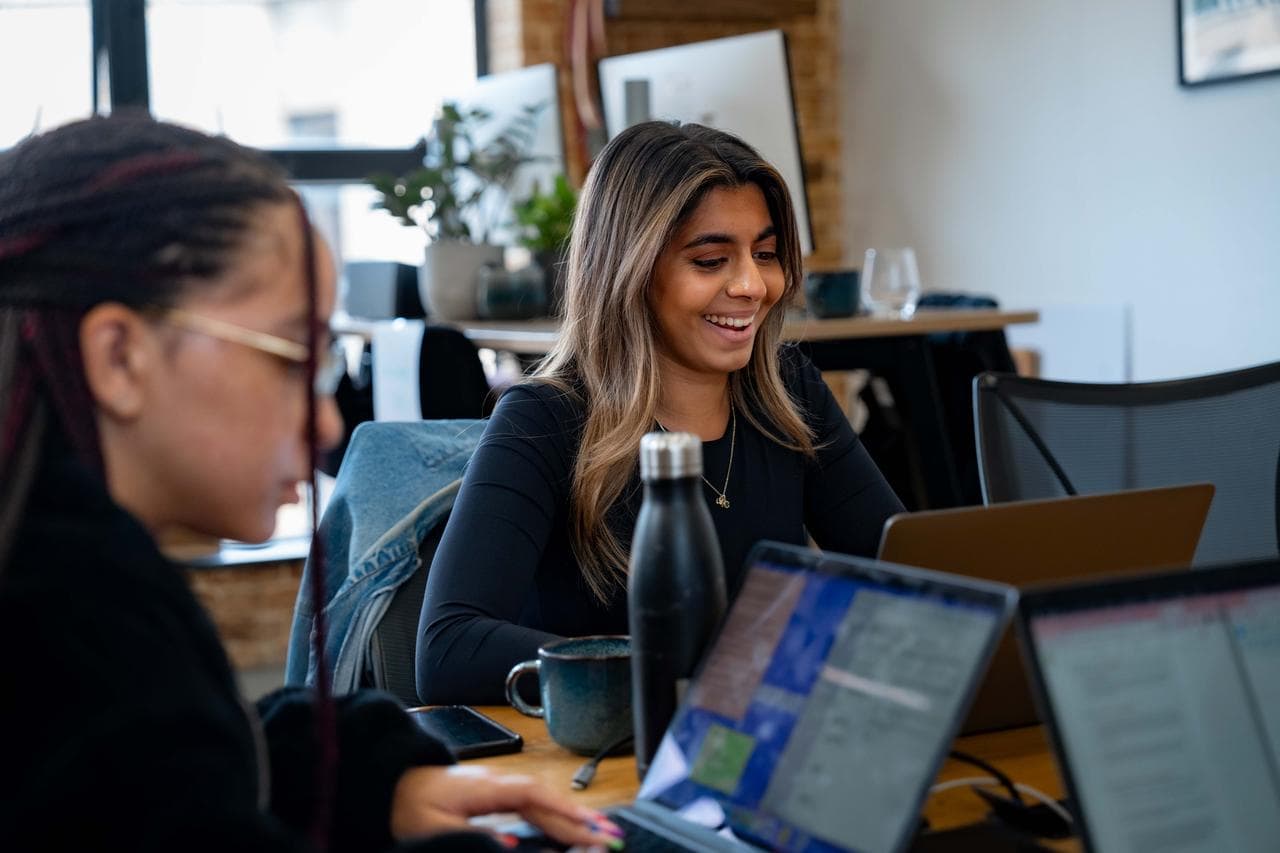 Girl on laptop smiling