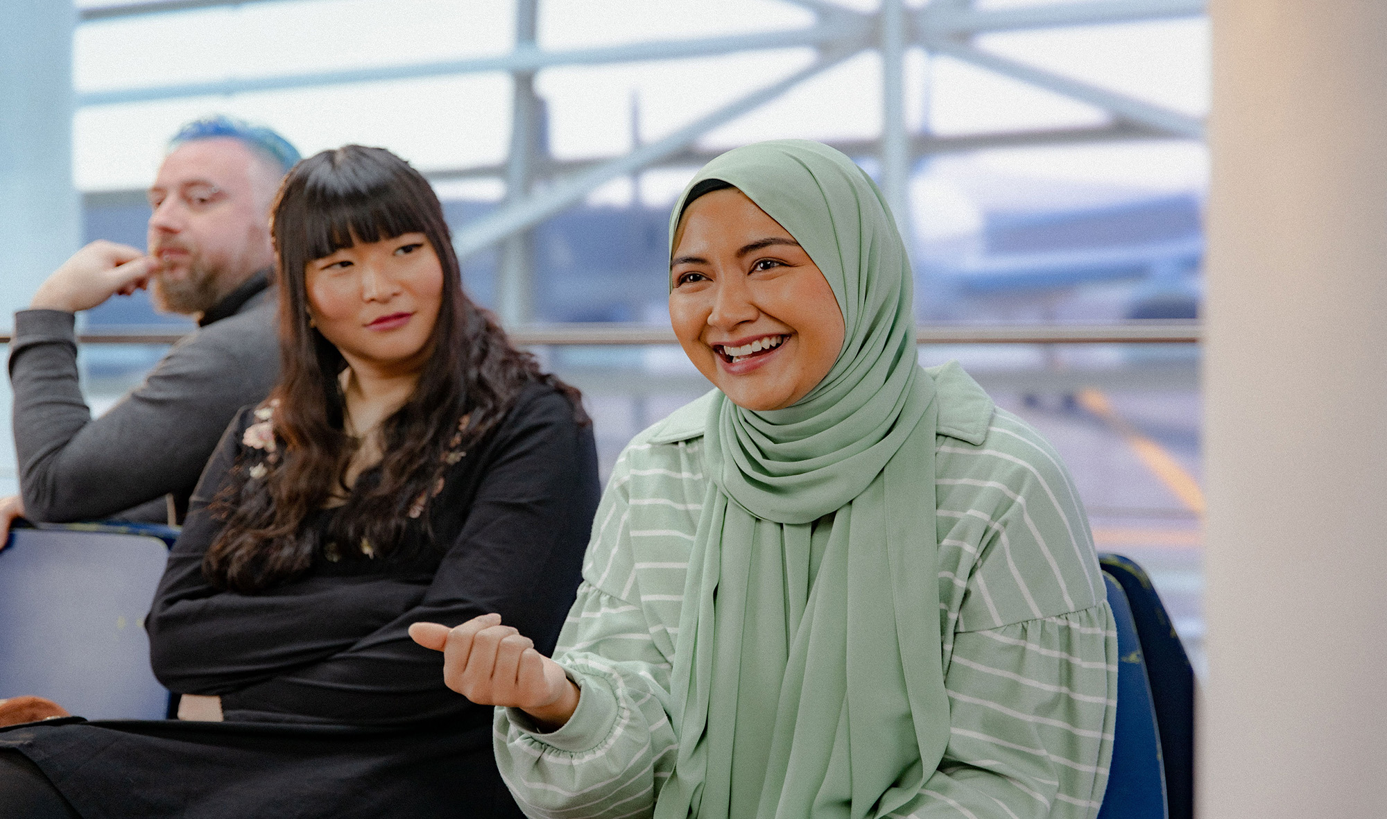 Two young female actors smiling in between shots during a video shoot