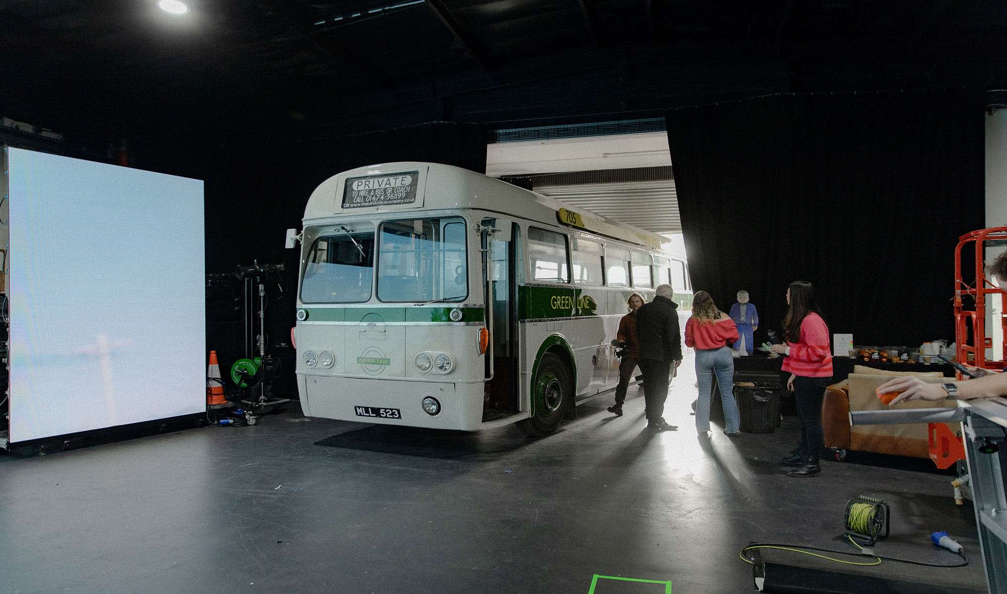 Image of large bus driving into the production studio