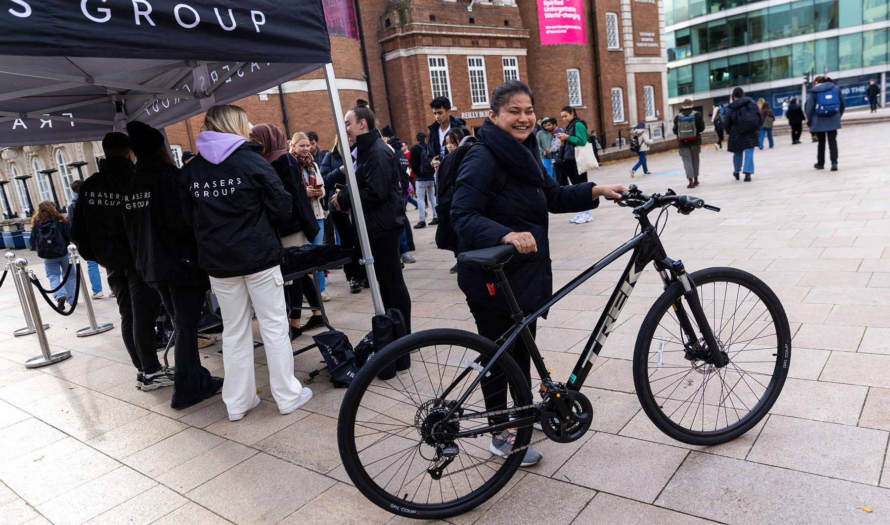 Image of female student after just winning a bike from Evans Cycles