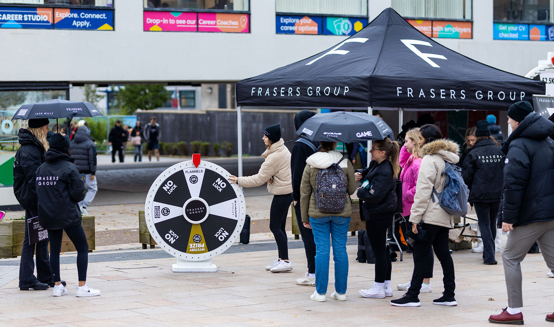 A queue of students waiting to spin the wheel