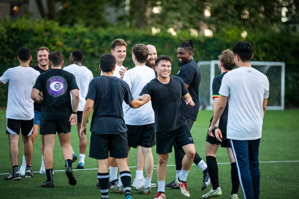 Work colleagues playing football