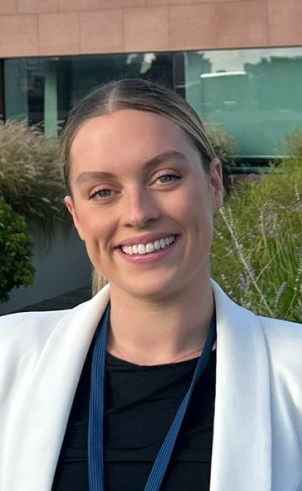 lady smiling in white jacket