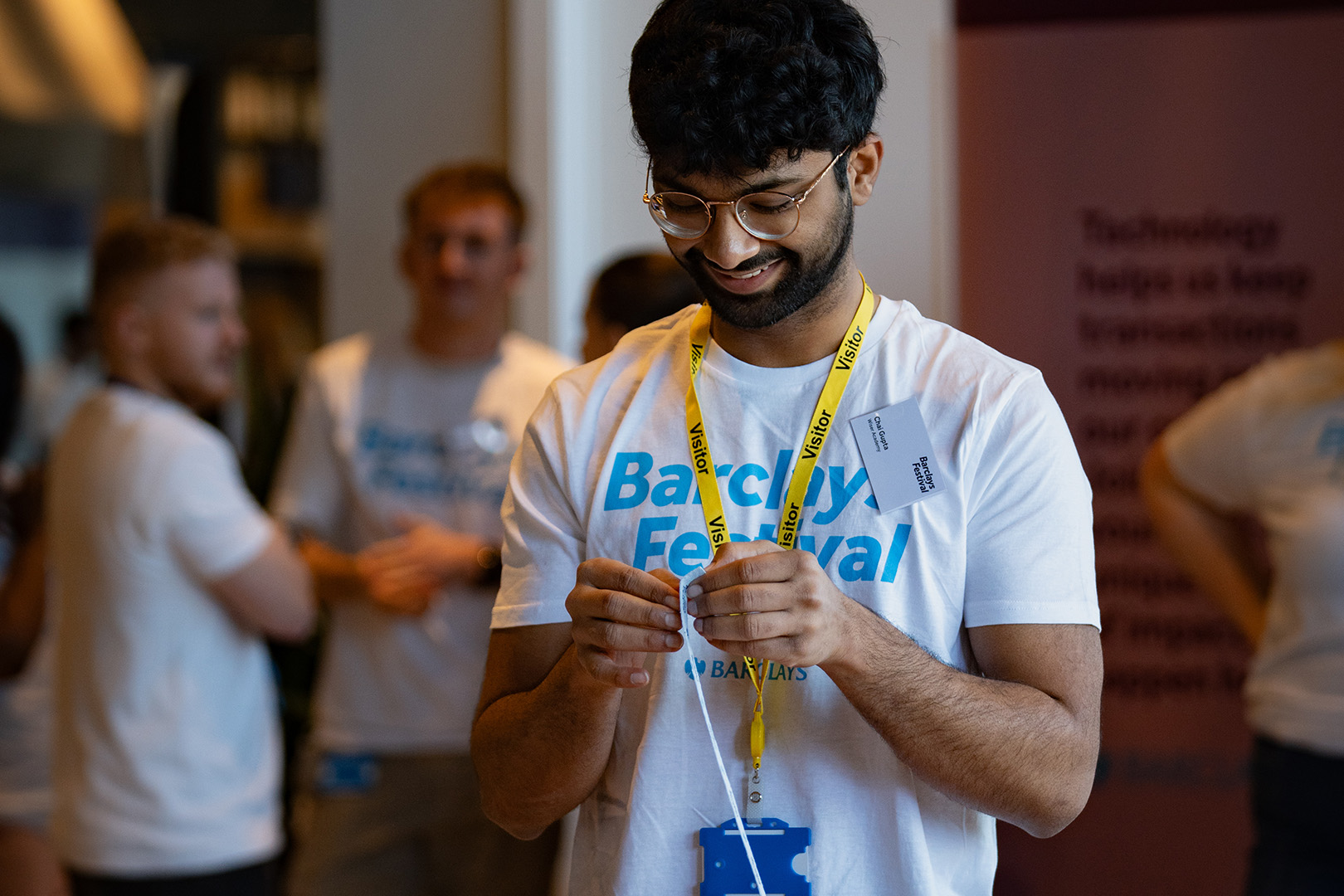 Image of student wearing Barclays merch at a festival event